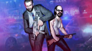 A man in a suit jacket and a man in a vest stand, armed, painted in red and blue light from a police car behind them.