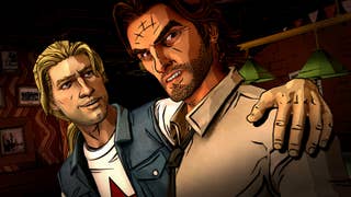 A grizzled, tanned-skinned man with a stubbly beard snarls at the camera. A man with blonde hair and a denim jacket has his arm around him.